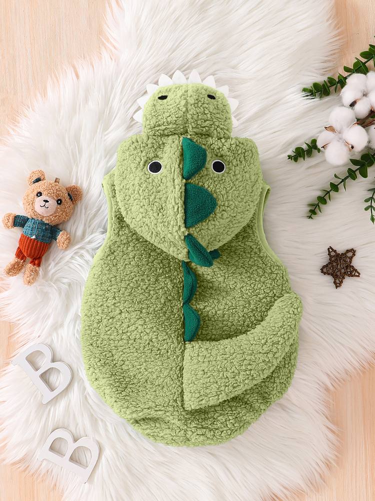 Matcha dinosaur romper from the back, with a row of dark green spikes and the tail