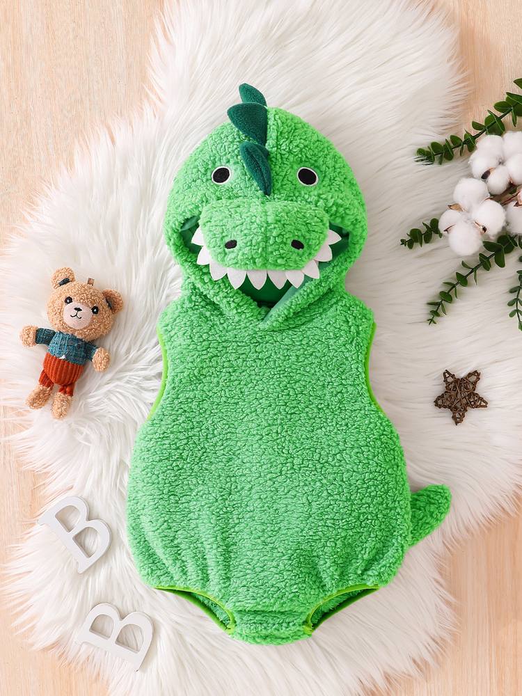 Green baby dinosaur costume romper laid flat, front view with the toothy hood