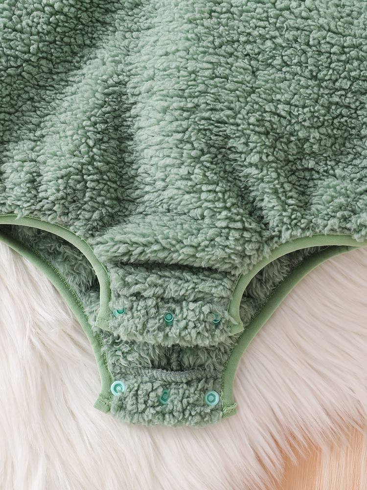 Close-up of the snaps at the crotch and the elastic leg openings