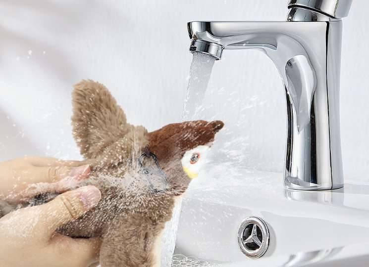 Washing Chirpy under a faucet