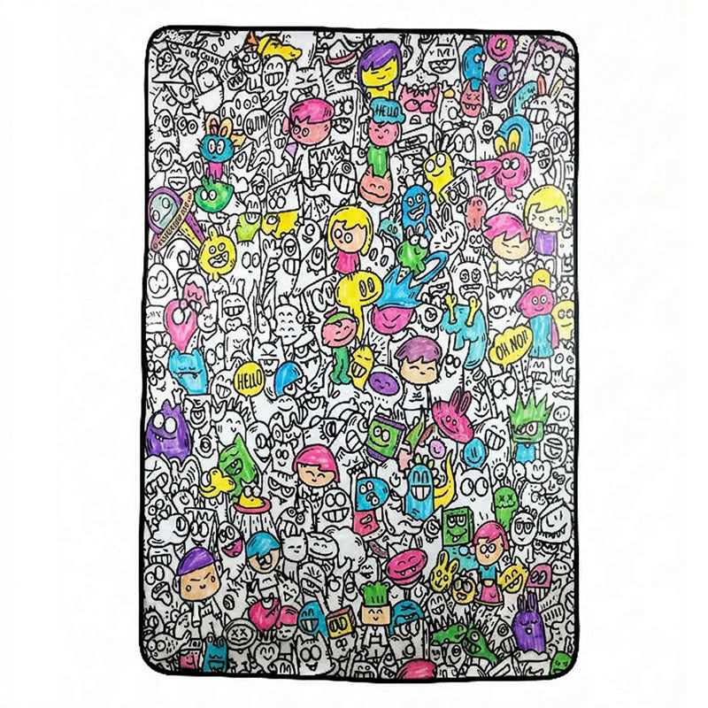 Kid coloring the Doodle Blanket with fabric markers