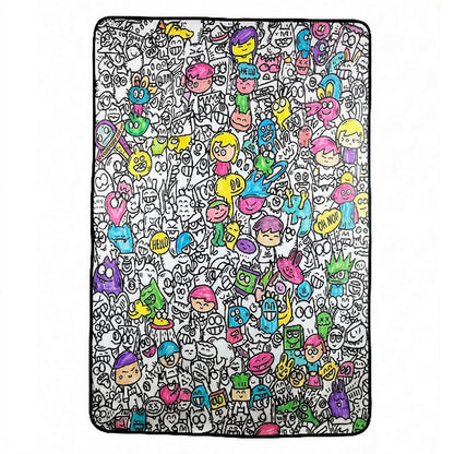 Kid coloring the Doodle Blanket with fabric markers