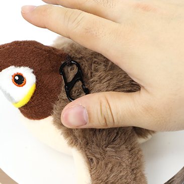 A hand tapping Chirpy's back